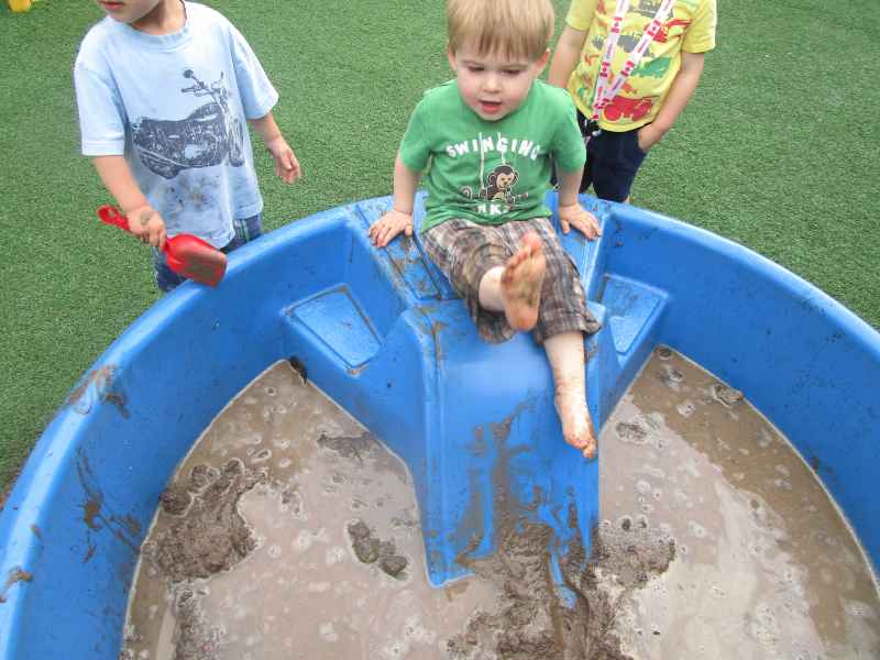 boy going down a mudslide